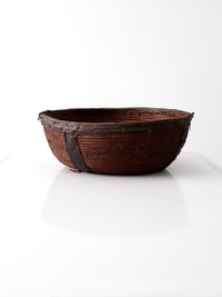 African basket bowl with leather