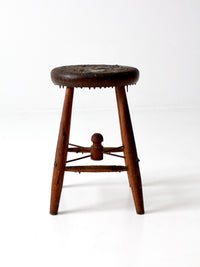 antique wooden stool with wire stretcher