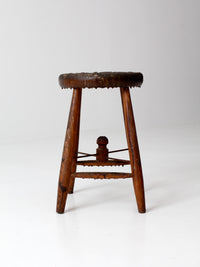 antique wooden stool with wire stretcher