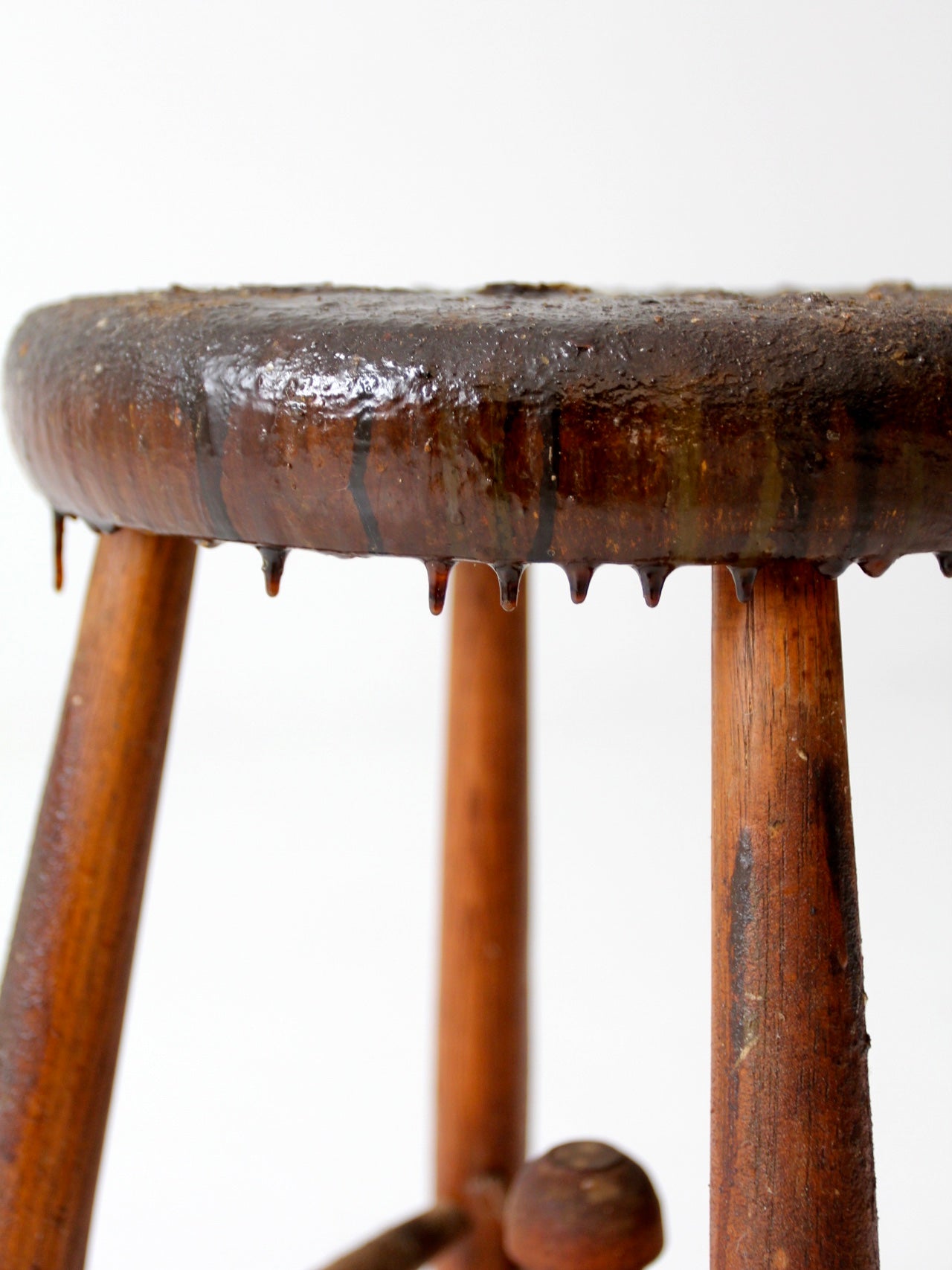 antique wooden stool with wire stretcher