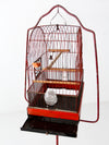 antique bird cage with cast iron stand
