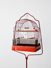 antique bird cage with cast iron stand