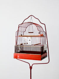 antique bird cage with cast iron stand