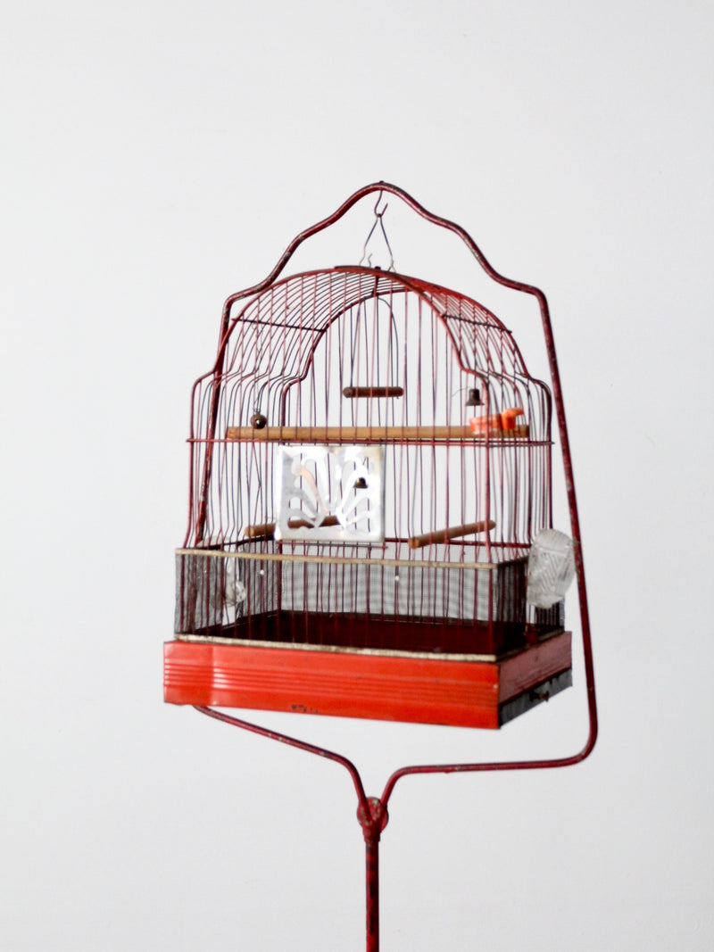 antique bird cage with cast iron stand