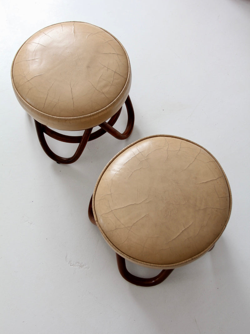 mid-century rattan swivel chairs with ottomans