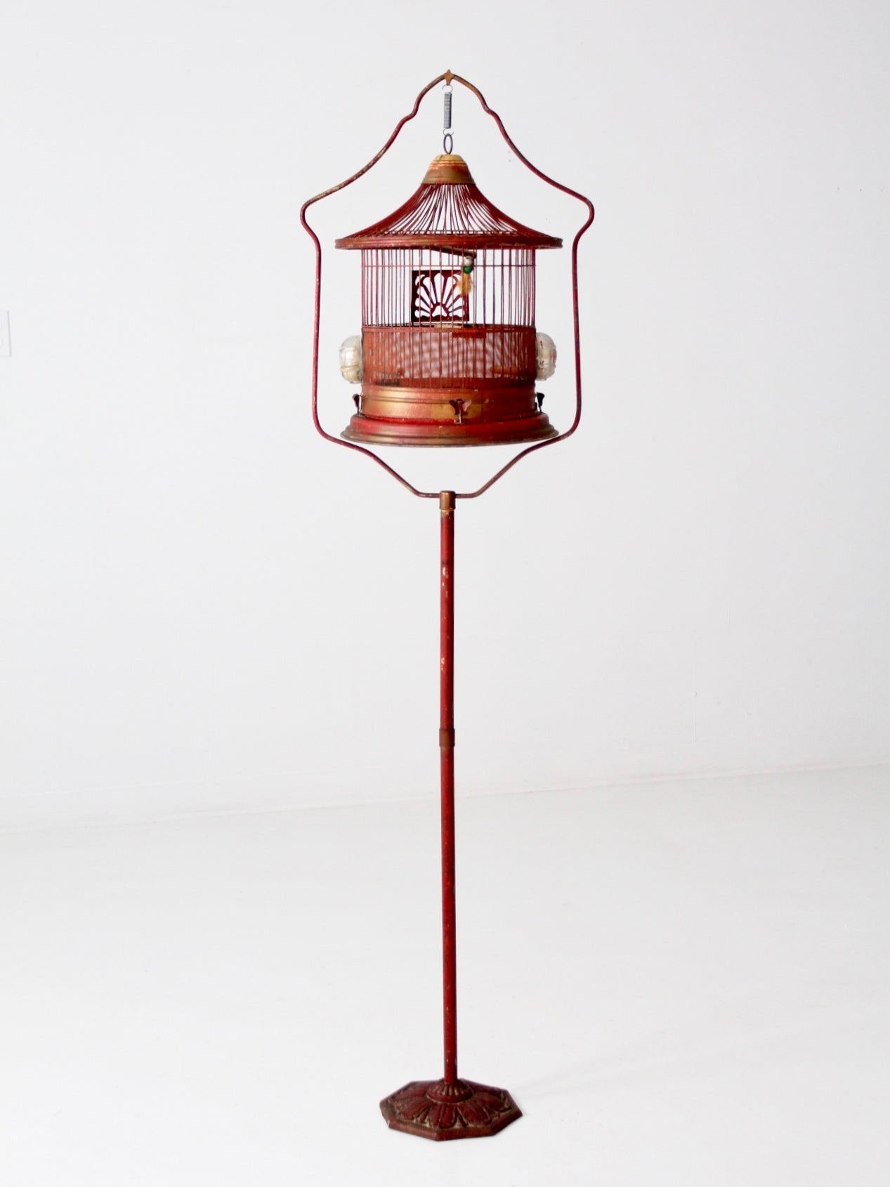 antique bird cage on stand