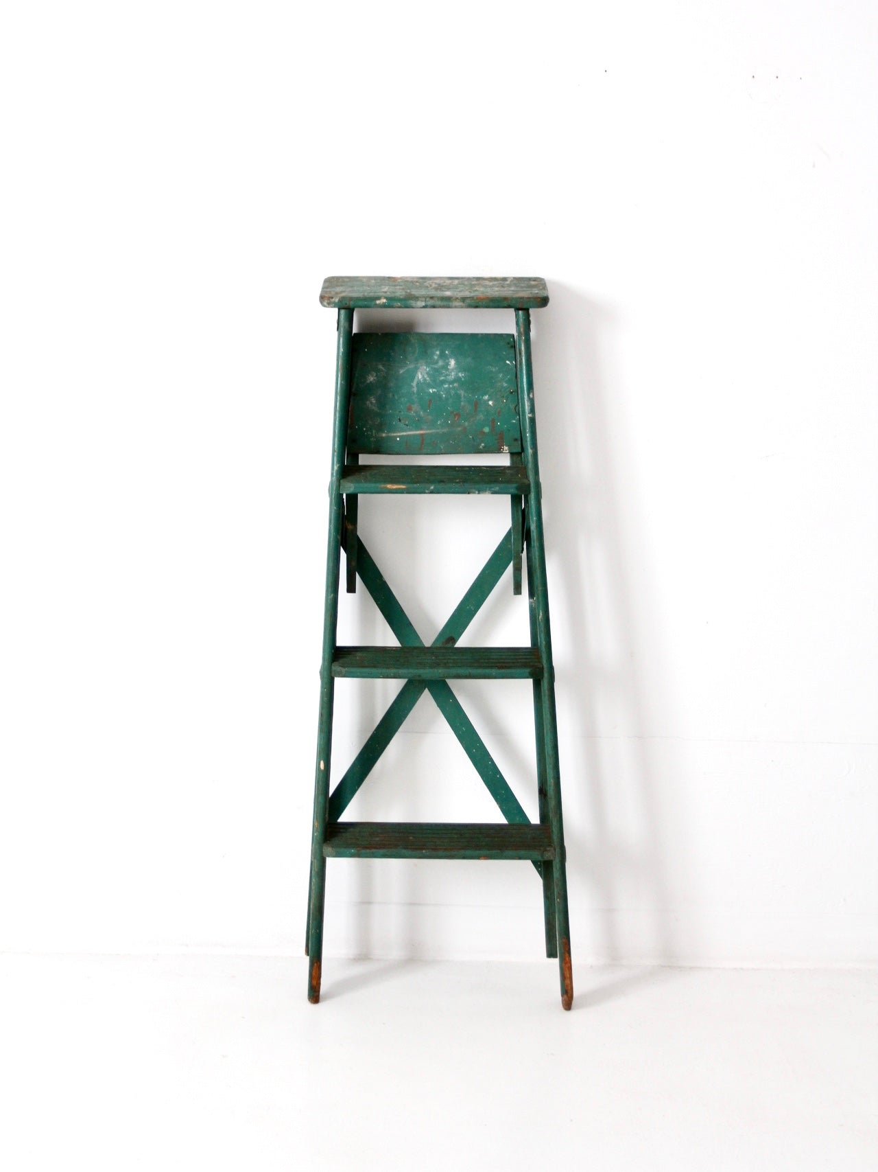 vintage green wood ladder
