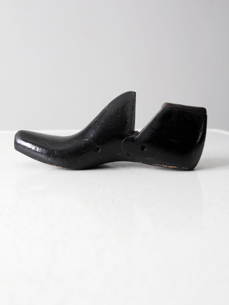 antique black wooden shoe form