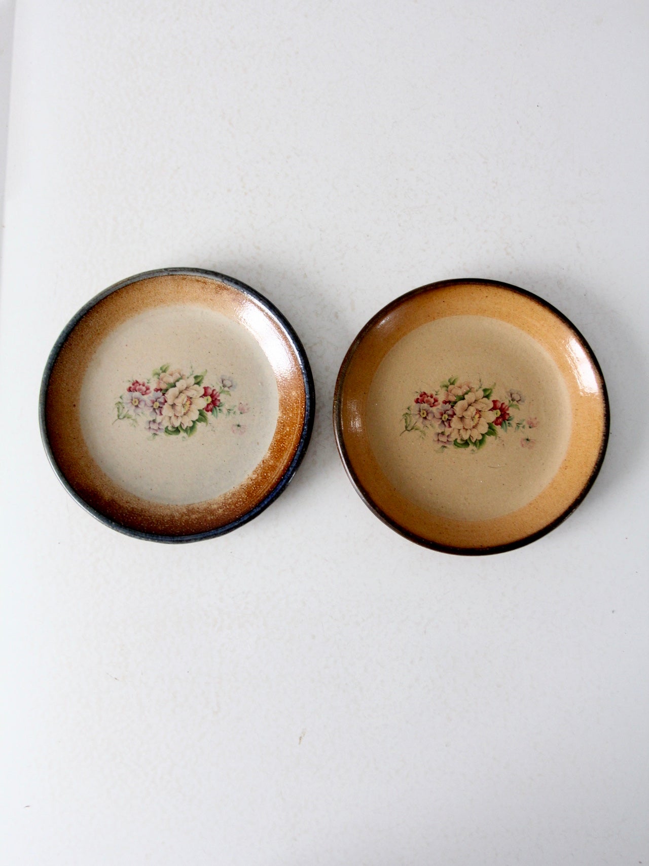 vintage floral pottery plates pair