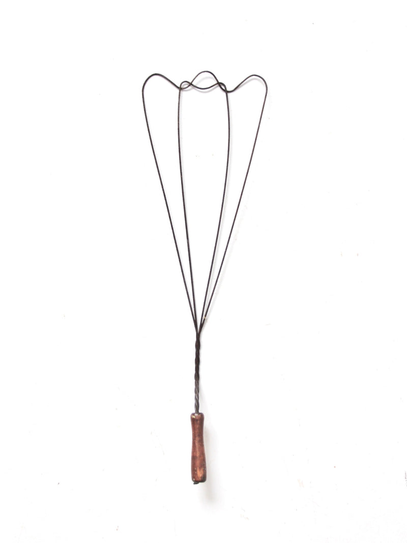 antique rug beater