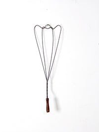 antique rug beater