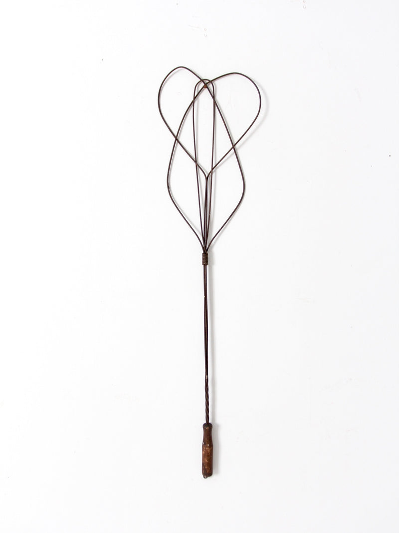 antique rug beater