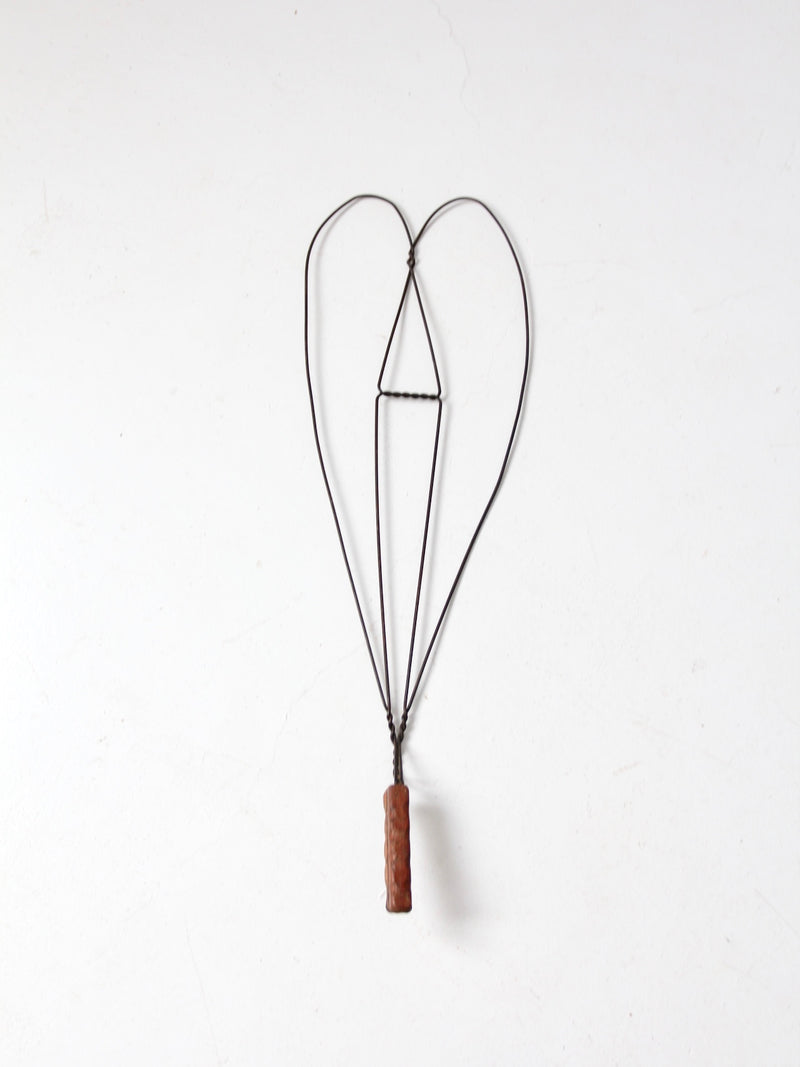 antique rug beater